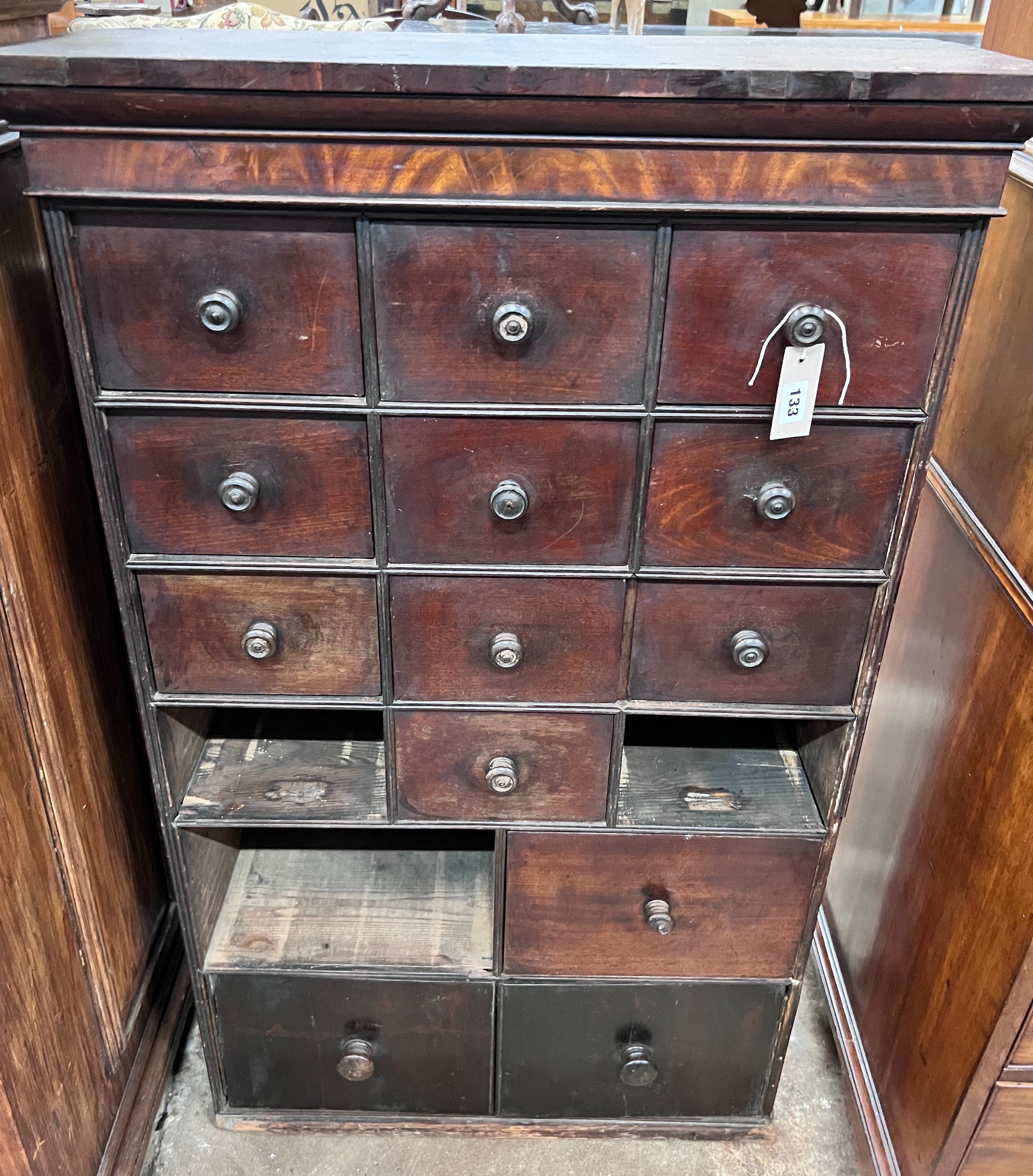A collector's chest (missing three drawers), width 70cm, depth 28cm, height 116cm *Please note the sale commences at 9am.